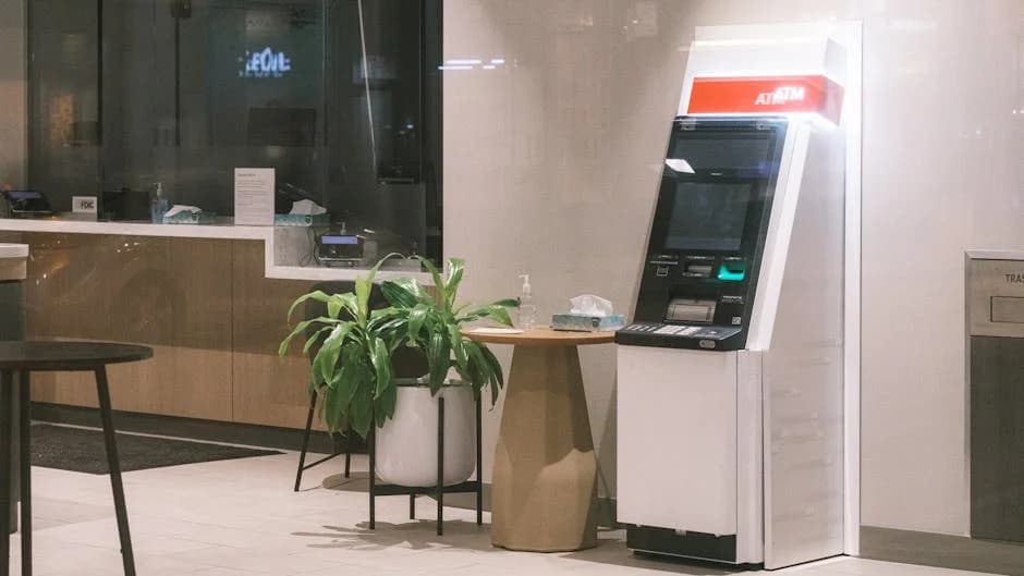 Professional cleaning crew maintaining a bank lobby and teller area