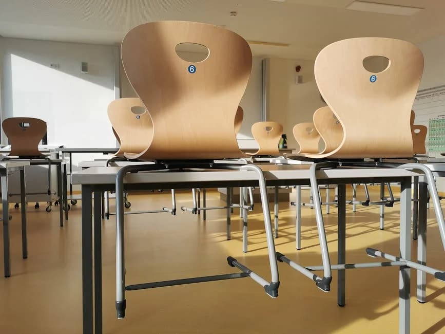 Clean school classroom with sanitized desks and maintained floors