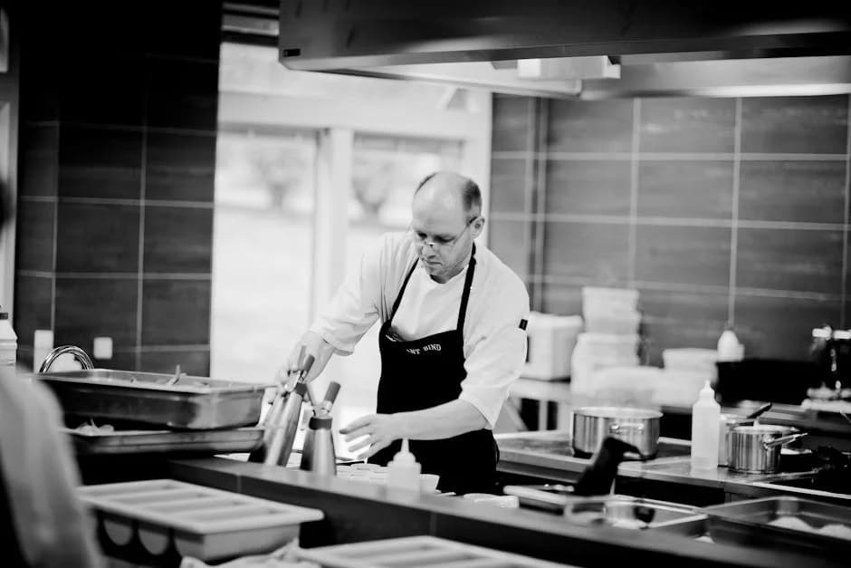 Hotel commercial kitchen cleaned and organized with stainless steel surfaces