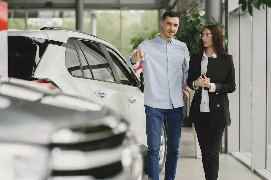 Clean auto dealership showroom with polished floors and organized sales floor