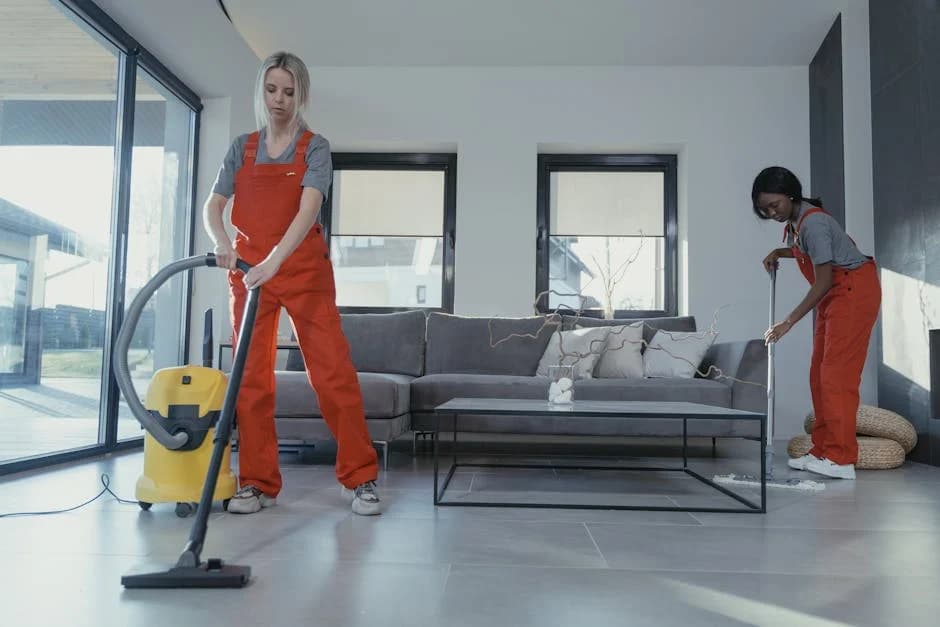 Professional cleaning technician cleaning a commercial office workspace