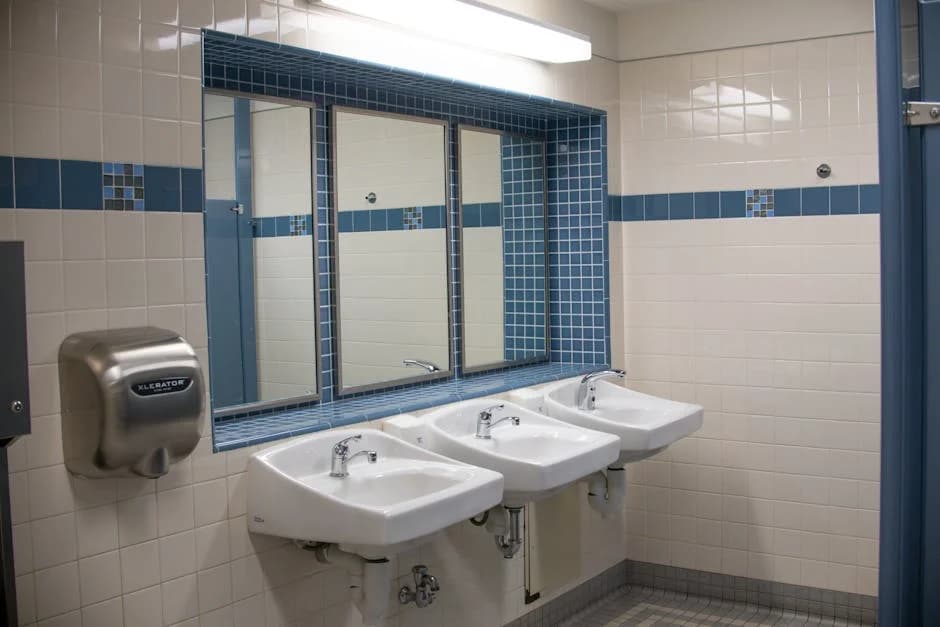 Clean school restroom with sanitized fixtures and maintained facilities