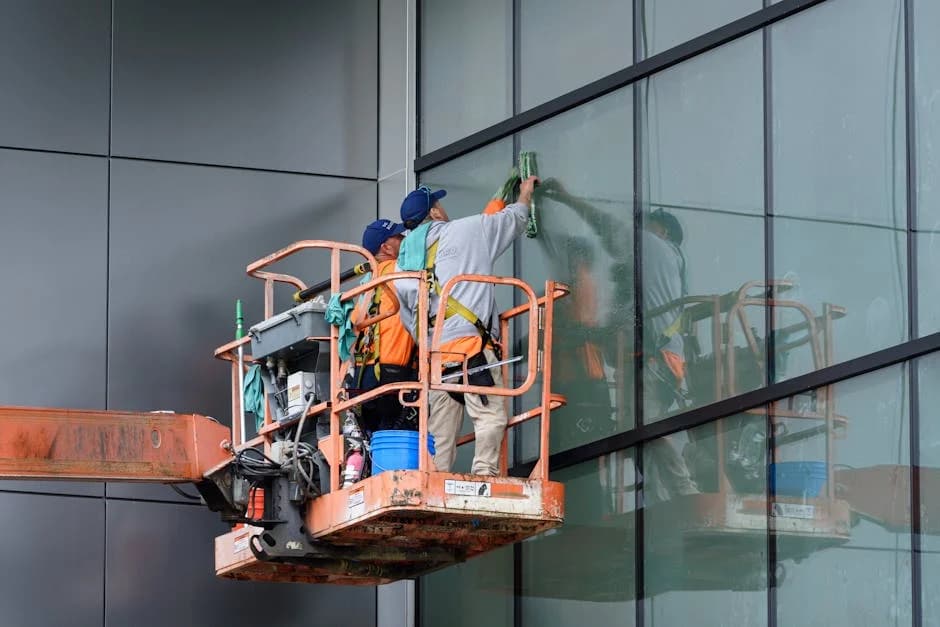 Professional construction cleaning crew preparing a new commercial facility for occupancy
